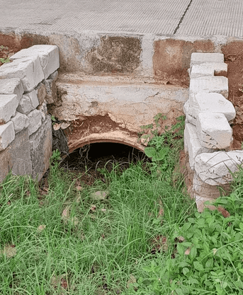 Storm culvert under sidewalk